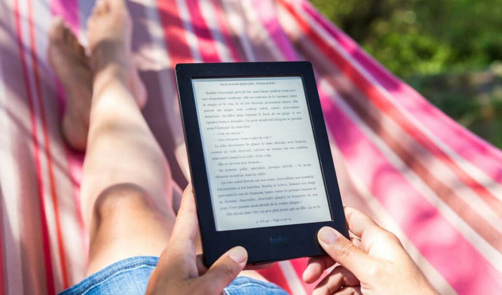 person reading story in Amazon Kindle tablet